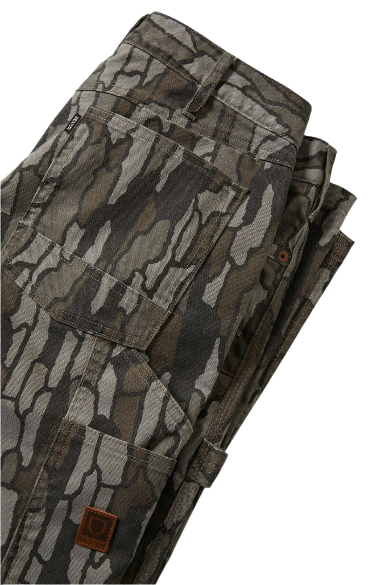 Folded camouflage pants on a white background