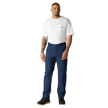 Man wearing a white t-shirt and blue pants on a plain background