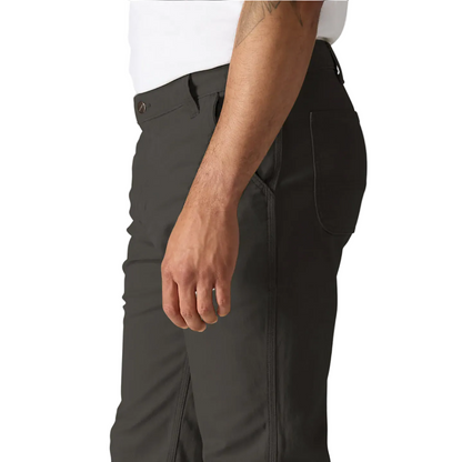 Dark gray pants worn by a person on a white background
