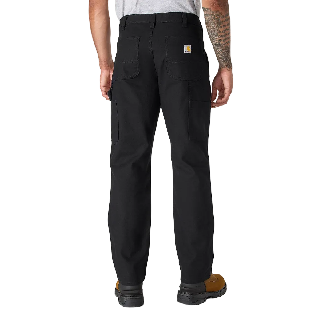 Person wearing black Carhartt pants on a white background