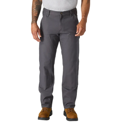 Person wearing gray pants and brown shoes on a white background