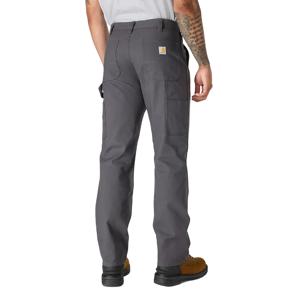 Person wearing gray work pants on a white background