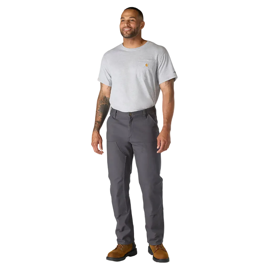 Man wearing a gray t-shirt and dark gray pants on a white background