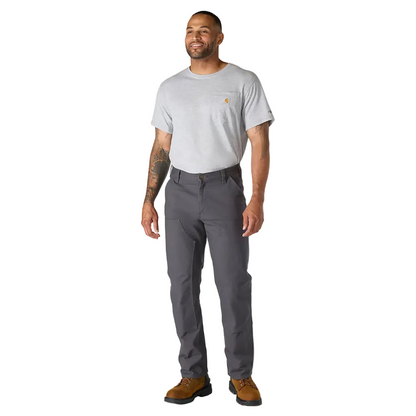 Man wearing a gray t-shirt and dark gray pants on a white background