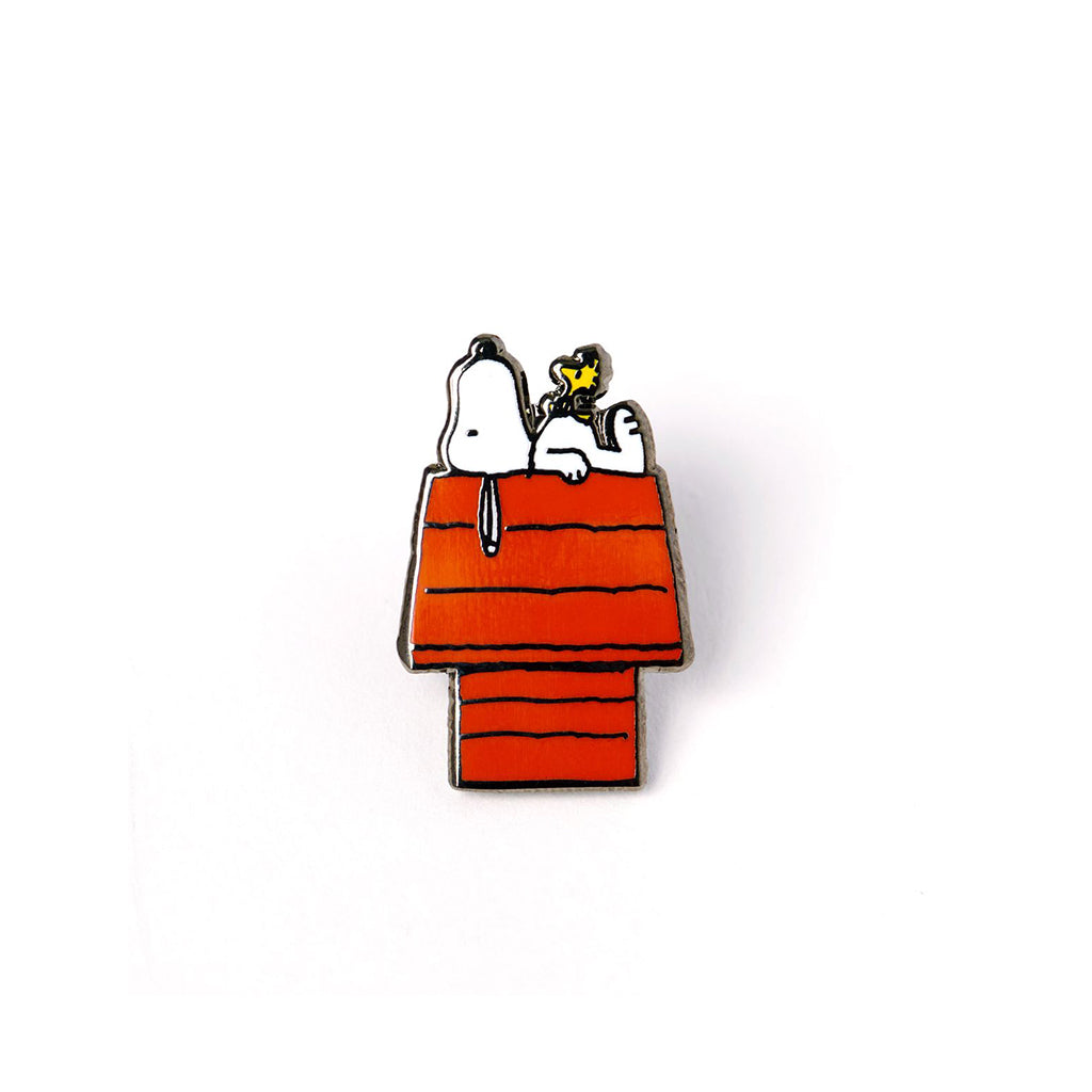 Pin with Snoopy and Woodstock on a doghouse against a white background