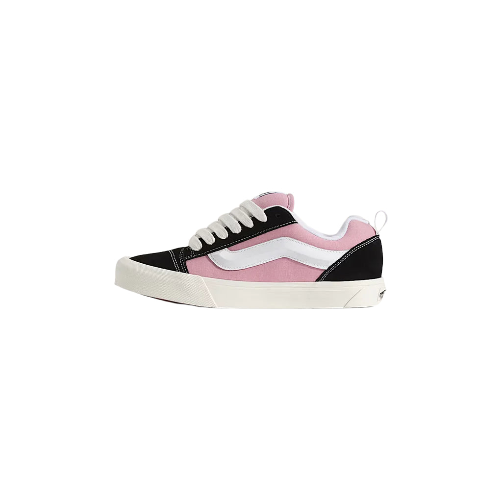 Pink and black sneaker with white sole on a light gray background