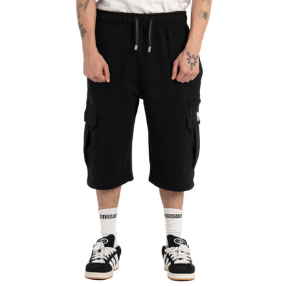 Person wearing black cargo shorts on a white background