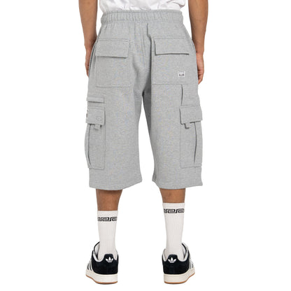 A person shown from the waist down wearing light gray heather cargo shorts, white socks, and black sneakers against a plain white studio background.