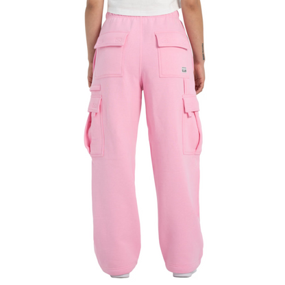 Pink cargo pants worn by a person on a white background