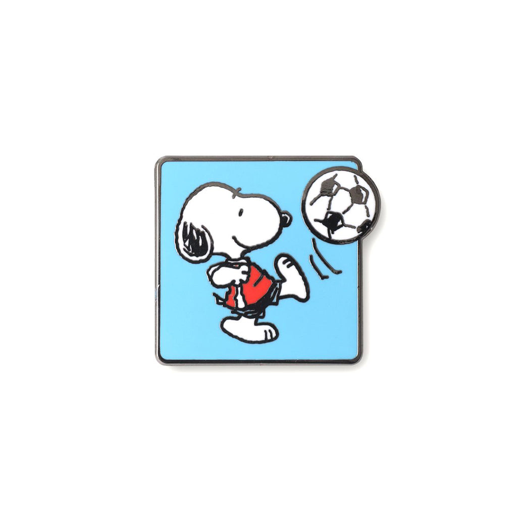 Snoopy playing soccer pin on a blue background