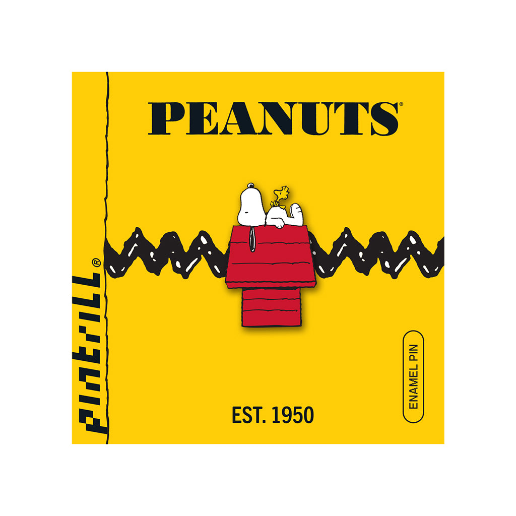 Peanuts enamel pin packaging with Snoopy on a doghouse on a yellow background