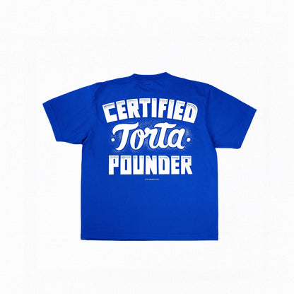 Blue t-shirt with white text 'CERTIFIED Torta Pounder' on a white background