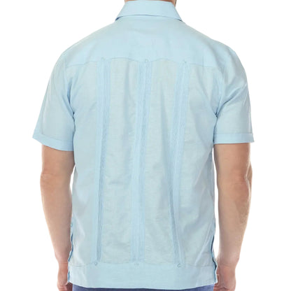 Man wearing a light blue short-sleeve shirt on a white background
