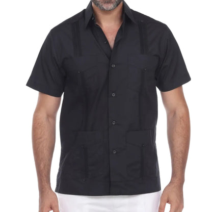 Man wearing a black short-sleeve shirt with button details on a white background